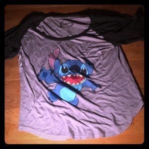 A grey and black stitch tee